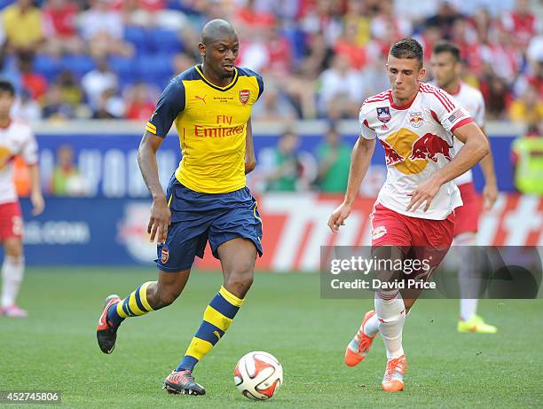 Abou Diaby of Arsenal holds off Matt Miazga of New York Red Bulls during the pre season match between New York Red Bulls and Arsenal at Red Bull...