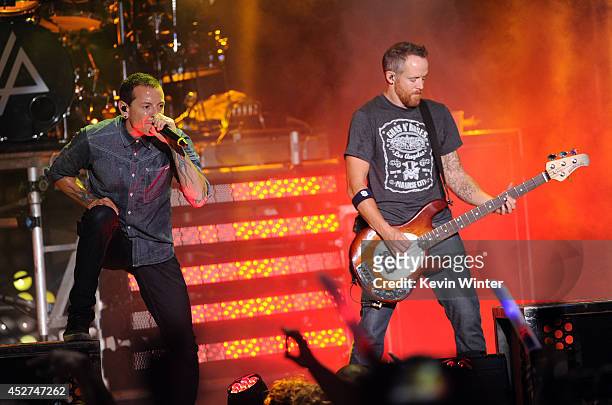 Singer Chester Bennington and musician Dave Farrell of Linkin Park performs onstage during the MTVu Fandom Awards at Comic-Con International 2014 at...