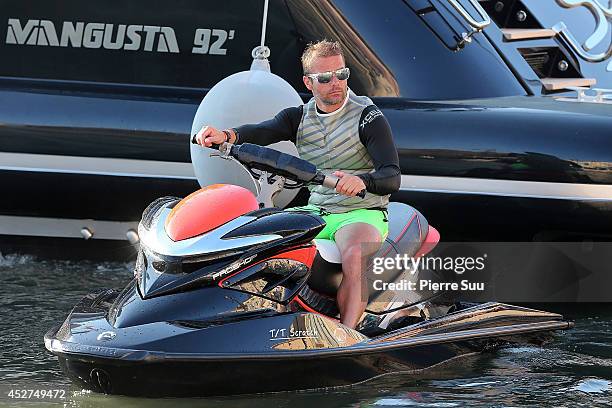 Sebastien Loeb is seen on his Jet ski in the port on July 26, 2014 in Saint-Tropez, France.