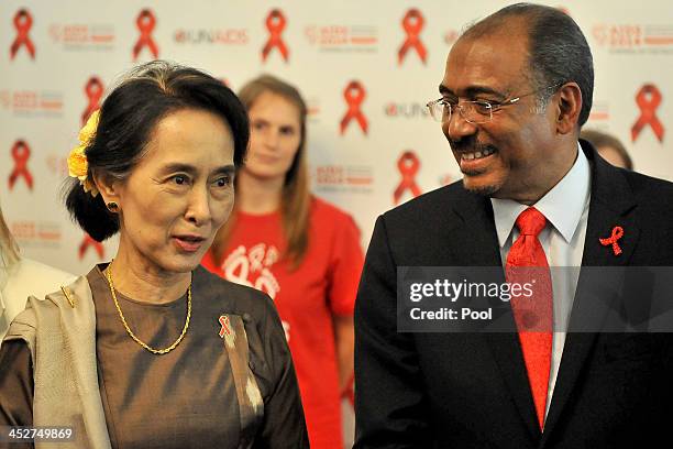 Nobel Peace Laureate and Myanmar opposition leader Aung San Suu Kyi and and UNAIDS executive director Michel Sidibe speak at the launch of the AIDS...