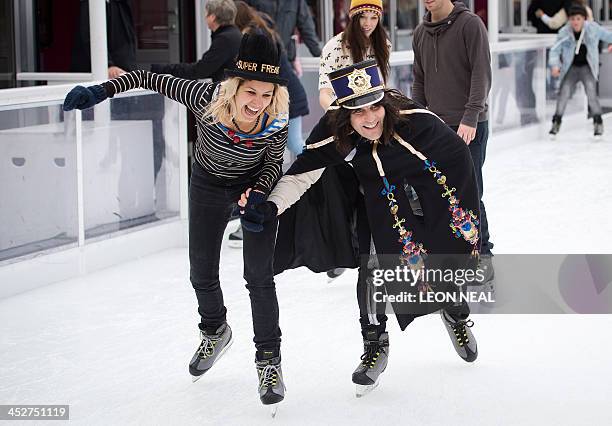 British comedian Noel Fielding and Radio DJ Lliana Bird take part in a "Hats Off to Isabella Blow!" event on the ice rink at Somerset House in...