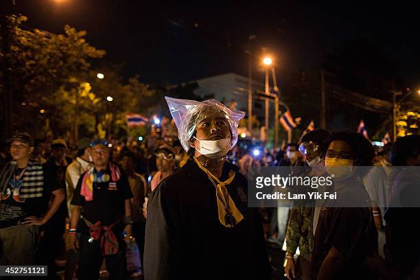 Anti-government protesters gather outside the government house on December 1, 2013 in Bangkok, Thailand. Anti-government protesters in Bangkok say...