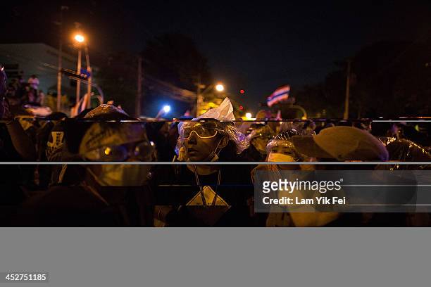 Anti-government protester gather outside the government house on December 1, 2013 in Bangkok, Thailand. Anti-government protesters in Bangkok say...