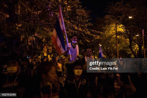 Anti-government protester gather outside the government house on December 1, 2013 in Bangkok, Thailand. Anti-government protesters in Bangkok say...