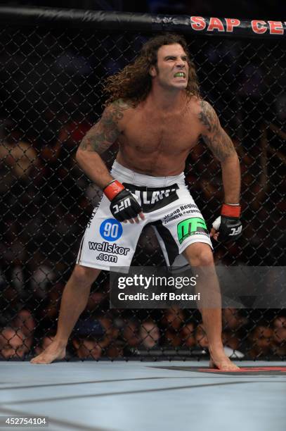 Clay Guida stares down Dennis Bermudez in the Octagon before their featherweight bout during the UFC Fight Night event at the SAP Center on July 26,...