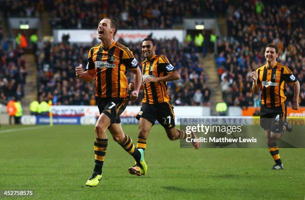 David Meyler of Hull City celebrates scoring his team's second goal with team mates during the Barclays Premier League match between Hull City and...