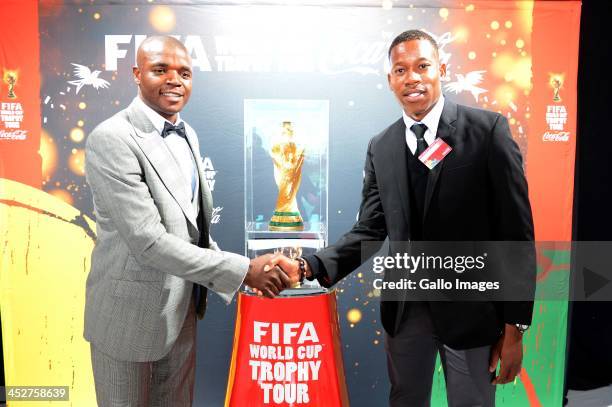 Aaron Mokoena and Happy Jele during the arrival of the FIFA World Cup Trophy at Lanseria Airport on December 01, 2013 in Johannesburg, South Africa.