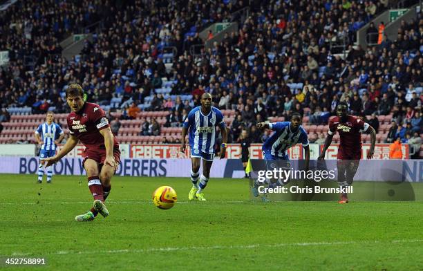 Chris Martin of Derby County scores his side's third goal from the penalty spot during the Sky Bet Championship match between Wigan Athletic and...