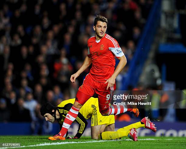 Jay Rodriguez of Southampton celebrates as he scores their first goal in the first minute as Petr Cech of Chelsea looks on during the Barclays...