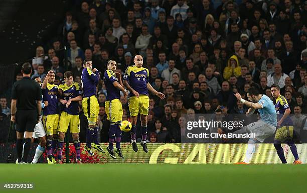 Alvaro Negredo of Manchester City scores the opening goal with a free kick during the Barclays Premier League match between Manchester City and...