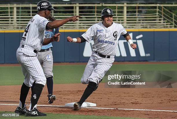 Oscar Robles of Guerreros runs to the third base during a match between Tigres de Quintana Roo and Guerreros de Oaxaca as part of the Mexican...