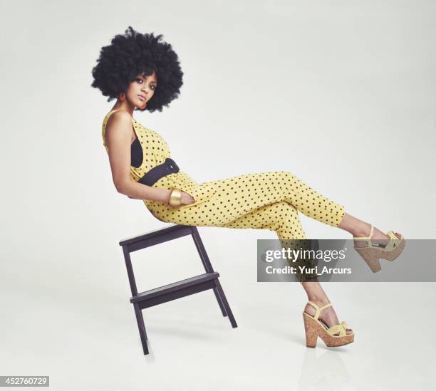 confidence - the perfect style accessory - chairs in studio stockfoto's en -beelden