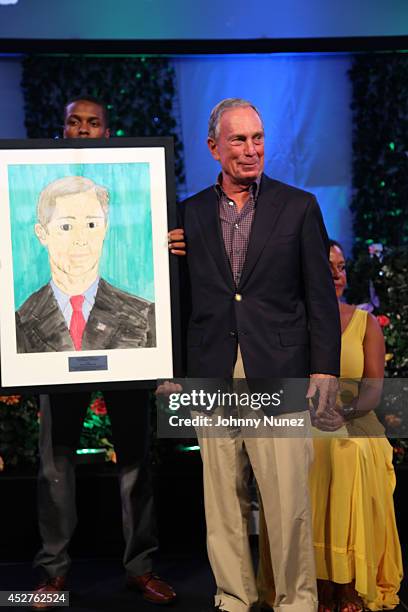 Honoree Michael Bloomberg poses on stage at the 15th annual Art for Life Gala hosted by Russell and Danny Simmons at Fairview Farms on July 26, 2014...