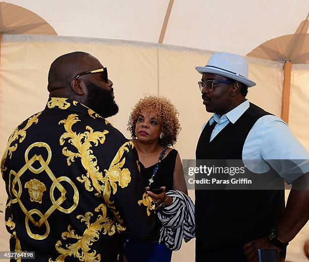 Rick Ross, Jamie Foster Brown, and Fab Five Freddy attend the 15th annual Art For Life Benefit at Fairview Farms on July 26, 2014 in Water Mill, New...