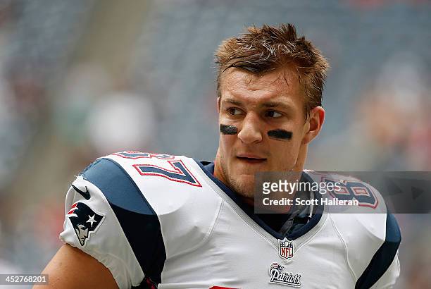 Rob Gronkowski of the New England Patriots works out on the field before the game against the Houston Texans at Reliant Stadium on December 1, 2013...