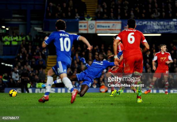 Demba Ba of Chelsea scores their third goal during the Barclays Premier League match between Chelsea and Southampton at Stamford Bridge on December...
