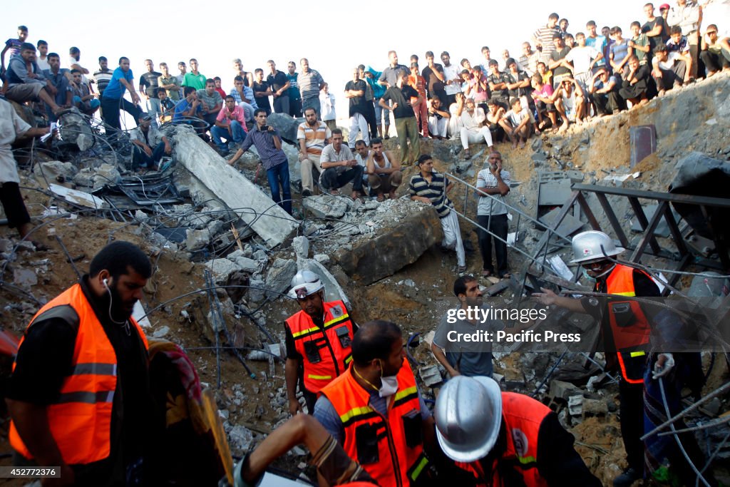 Rescue workers search for bodies of the family-Najjar, from...