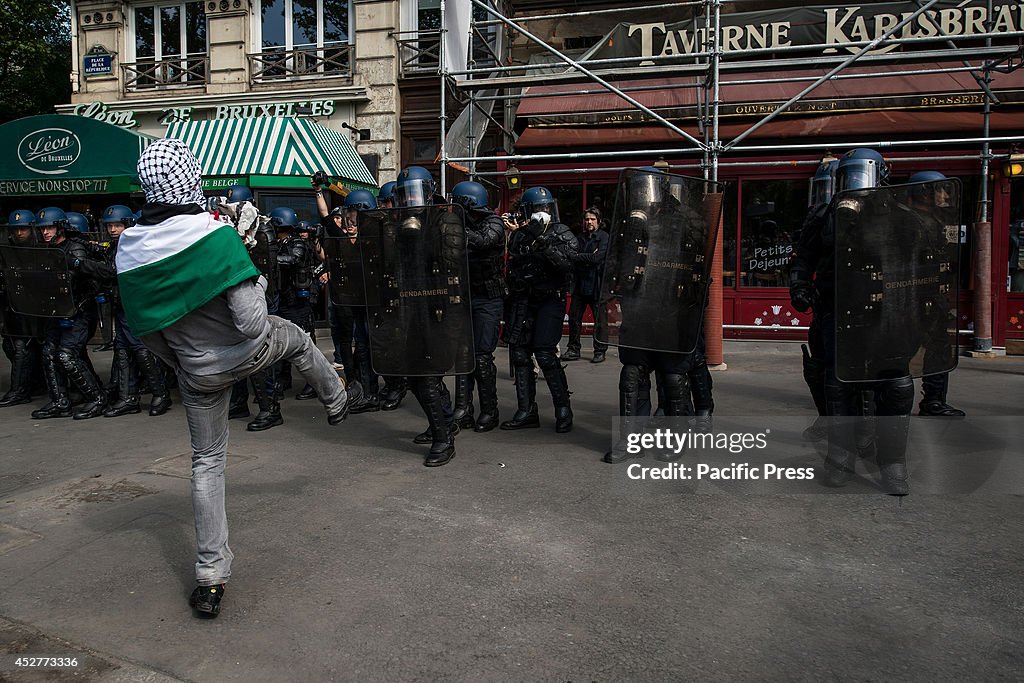 Some youngsters trying to provoke the anti-riot police in an...