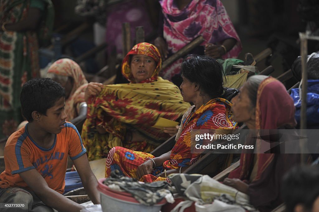 Leprosy patients wait in front of the Press Club in Dhaka...