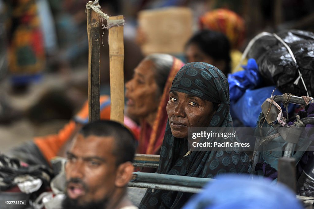 Leprosy patients wait in front of the Press Club in Dhaka...