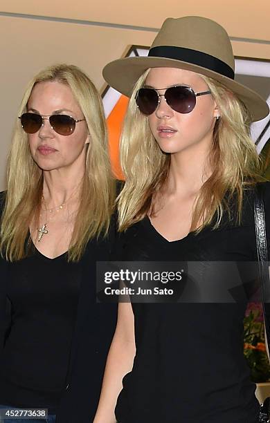 Actress Nicola Peltz and her mother model Claudia Peltz seen upon arrival at Narita International Airport on July 27, 2014 in Tokyo, Japan.