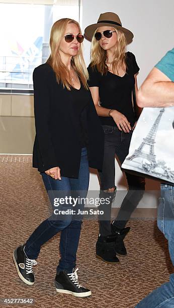 Actress Nicola Peltz and her mother model Claudia Peltz seen upon arrival at Narita International Airport on July 27, 2014 in Tokyo, Japan.