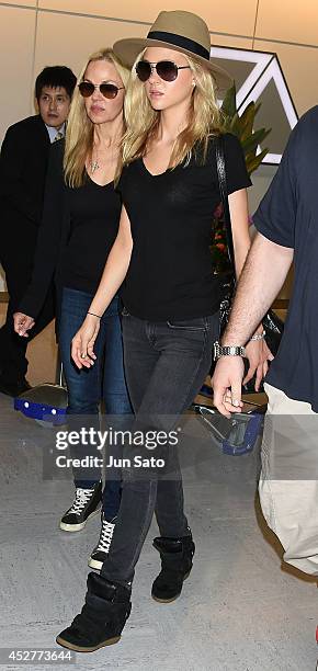 Actress Nicola Peltz and her mother model Claudia Peltz seen upon arrival at Narita International Airport on July 27, 2014 in Tokyo, Japan.