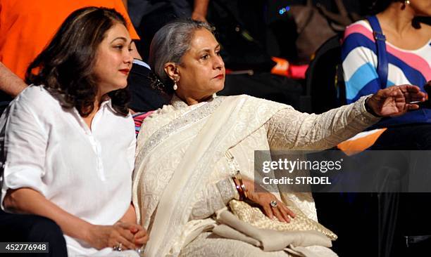 Indian Bollywood actresses Tina Ambani and Jaya Bachchan look on during a professional kabaddi league match in Mumbai on late July 26, 2014. AFP...