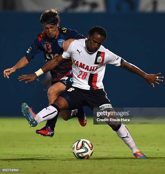 Tinga, whose real name is Paulo Cesar Fonseca do Nascimento of Jubilo Iwata and Yosuke Nozaki of Yokohama FC compete for the ball during the J....