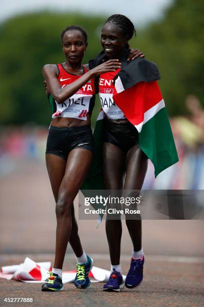 Flomena Cheyech Daniel and Caroline Kilel of Kenya celebrate together after they finish first and second in the Women's Marathon on the city marathon...