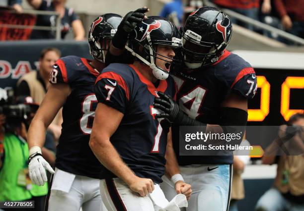 Case Keenum of Houston Texans celebrates after running for a five yard touchdown in the third quarter during the game against the New England...