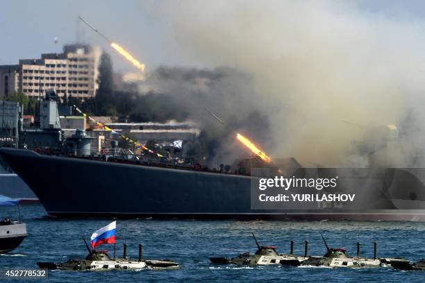 The Yamal, a Ropucha-class landing ship of the Russian Navy, fires rockets during Navy Day celebrations in the Crimean city of Sevastopol on July 27,...