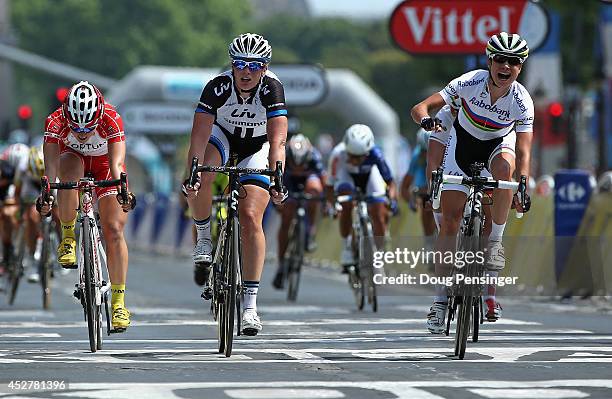 Marianne Vos of the Netherlands and Rabo Liv celebrates as she crosses the line to claim victory in 'La Course by Le Tour de France' on July 27, 2014...