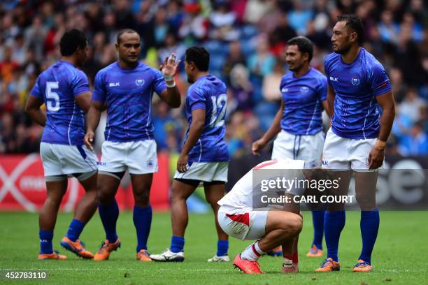 Christian Lewis-Pratt of England appears dejected after England lost to Samoa during the Rugby Sevens quarter-final match between Samoa and England...