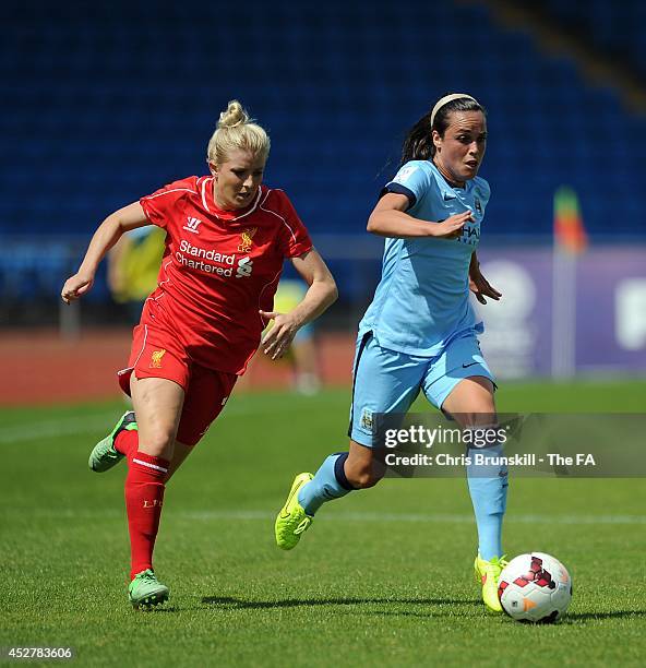 Emma Kete of Manchester City Women is chased by Kate Longhurst of Liverpool Ladies during the FA WSL 1 match between Manchester City Women and...