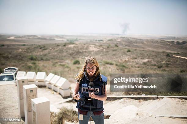 Reporter does a stand-up near the border as a 24 hour ceasefire begins on July 27, 2014 on the Israeli/Gaza border, Israel. Forty-two Israeli...