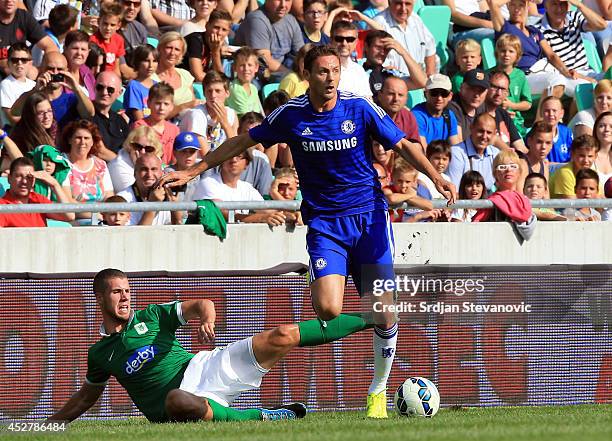 Nemanja Matic of Chelsea in action against Kenan Bajric of FC Olimpija Ljubljana during the Pre Season Friendly match between FC Olimpija Ljubljana...