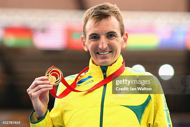 Gold medalist Michael Shelley of Australia stands on the podium during the medal ceremony for the Men's Marathon at Hampden Park Stadium during day...