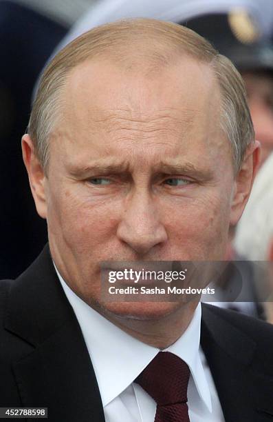 Russian President Vladimir Putin watches the Navy Day Military parade July 27, 2014 in Severomorsk. Putin is having a visit to Northern Fleet main...