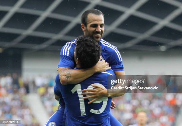 Diego Costa of Chelsea celebrate the scoring the goal with Cesc Fabregas during the Pre Season Friendly match between FC Olimpija Ljubljana and...