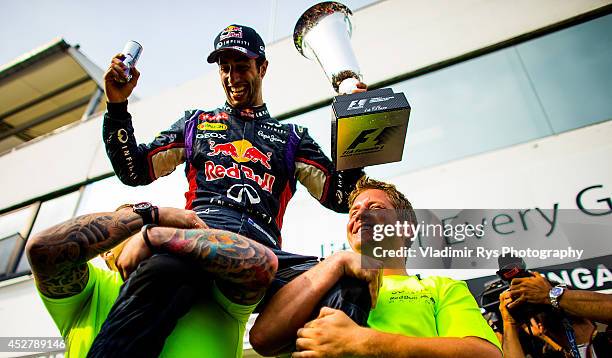 Daniel Ricciardo of Australia and Infiniti Red Bull Racing celebrates with his team after winning the Hungarian Formula One Grand Prix at Hungaroring...