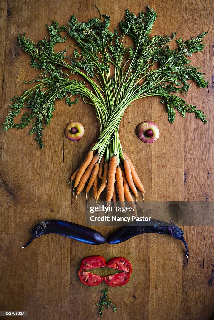 Facial illustrations made from vegetables and frui