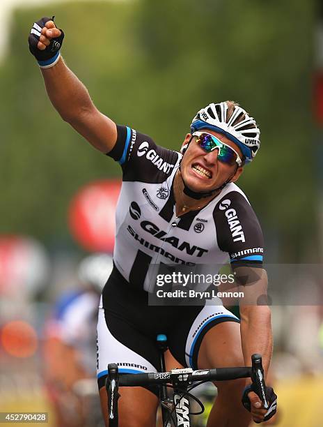 Marcel Kittel of Germany and Team Giant-Shimano celebrates as he crosses the line to win the twenty first stage of the 2014 Tour de France, a 138km...