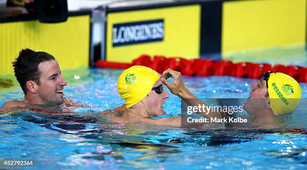 James Magnussen of Australia celebrates winning the gold medal in the Men's 100m Freestyle Final with silver medallist Cameron McEvoy and bronze...