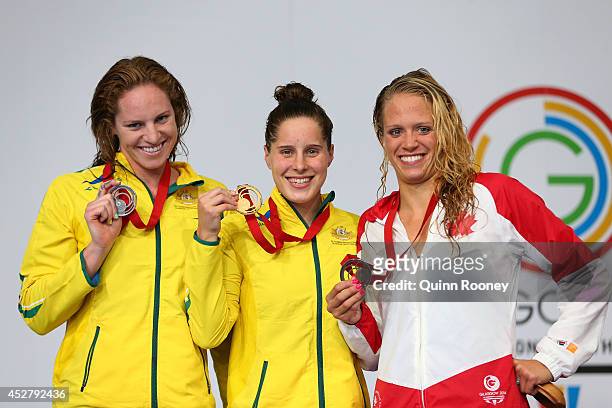 Gold medallist Belinda Hocking of Australia poses with silver medallist Emily Seebohm of Australia and bronze medallist Hilary Caldwell of Canada...