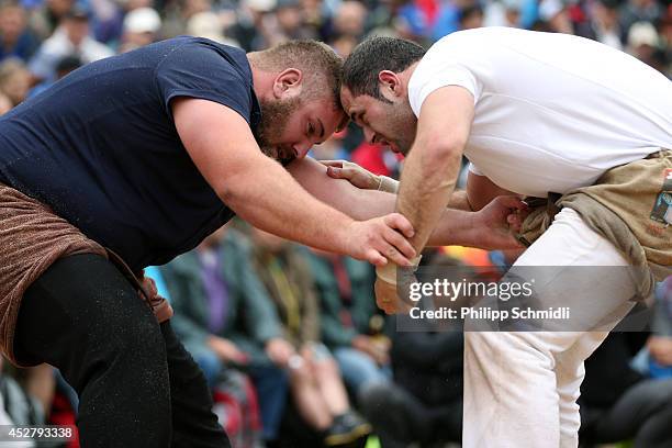 Fabian Kindlimann fights with Simon Jampen during the Alpine Wrestling Festival Bruenig-Schwinget at the top of the Bruenig Pass on July 27, 2014 in...