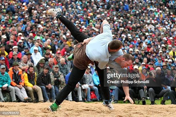 Swiss Alpine wrestler Matthias Sempach fights with Adrian Laimbacher during the Alpine Wrestling Festival Bruenig-Schwinget at the top of the Bruenig...