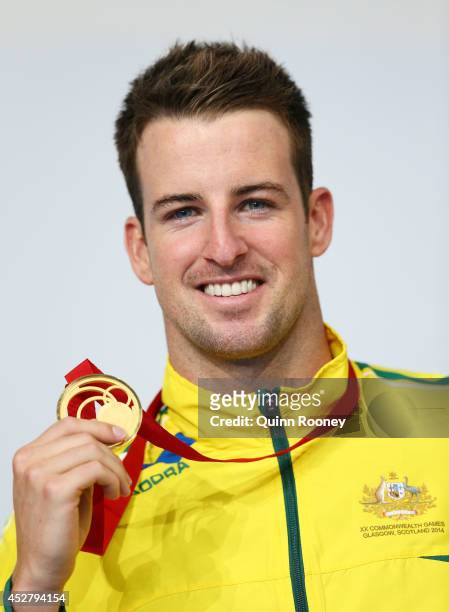 Gold medallist James Magnussen of Australia poses during the medal ceremony for the Men's 100m Freestyle Final at Tollcross International Swimming...