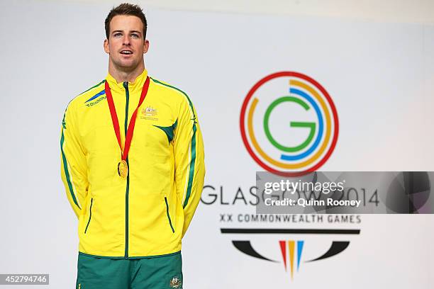 Gold medallist James Magnussen of Australia poses during the medal ceremony for the Men's 100m Freestyle Final at Tollcross International Swimming...