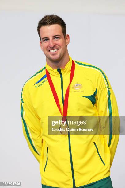 Gold medallist James Magnussen of Australia poses during the medal ceremony for the Men's 100m Freestyle Final at Tollcross International Swimming...